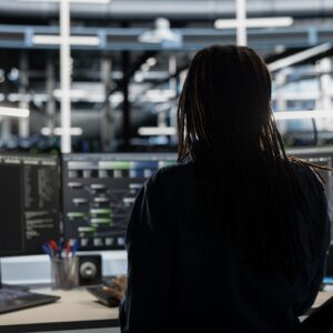 Data center technician uses AI visualization tool on PC to oversee tasks